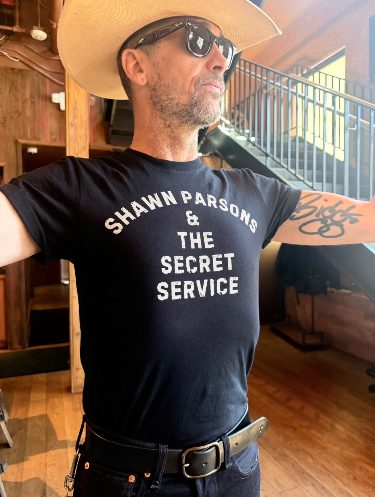 Person wearing the black Shawn Parsons & The Secret Service shirt